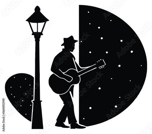 Silhouette of a musician playing guitar under a streetlight at night time