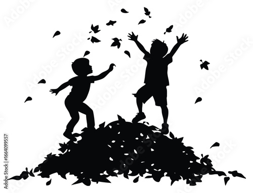 Silhouette of children playing in a pile of autumn leaves enjoying the fall season