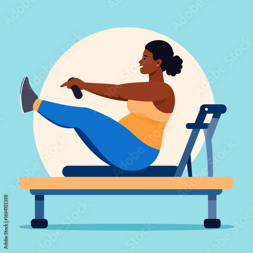 Smiling Black woman in blue leggings and an orange top doing a pilates reformer exercise.