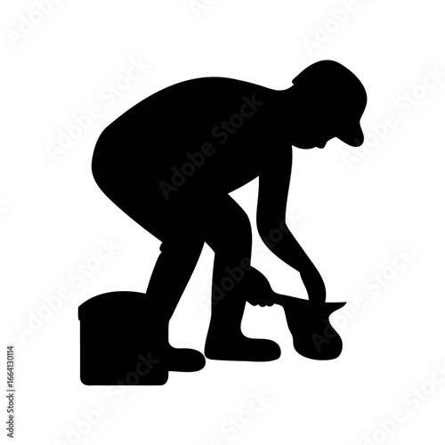 Silhouette of a person gardening and taking something out of a pot