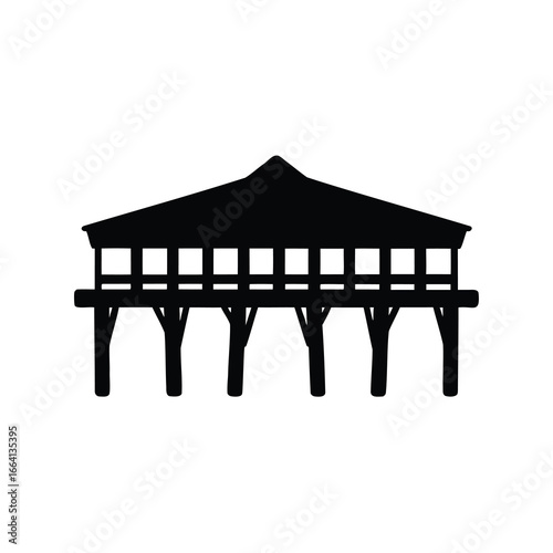Silhouette of a wooden pier or gazebo with a roof structure