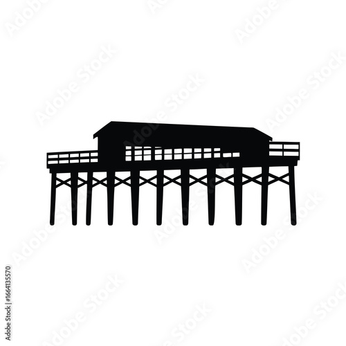 Silhouette of a wooden pier structure with a building on top, elevated over water