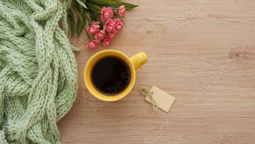 Top view of coffee cup with knit blanket and small plants