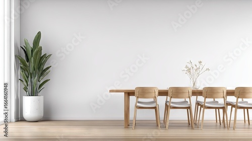Modern dining area with light wood furniture and a potted plant.