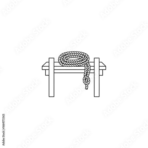 rope on a sawhorse a rustic and utilitarian woodworking setup with a coiled rope draped across the structure symbolizing diy projects and craftsmanship