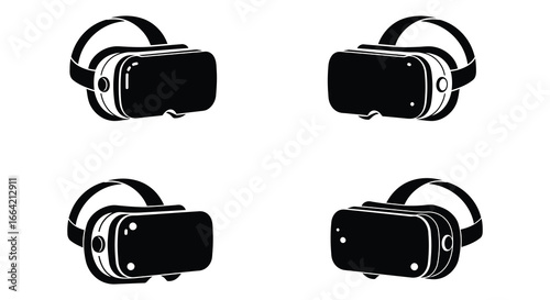 Four black virtual reality headsets in different orientations on white background