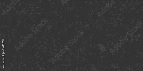A black background with no visible objects. The background is a solid black color and has a rough texture