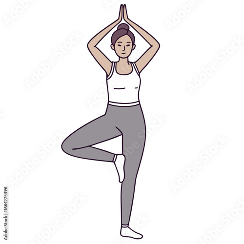 Woman in white tank top and grey leggings performing tree pose yoga vrikshasana