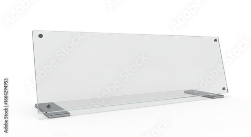 Transparent rectangular sign on a white backdrop held by metal supports and screws