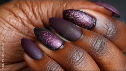Elegant Glossy Burgundy Nail Design with Textured Finish on Beautiful Hand Close-Up