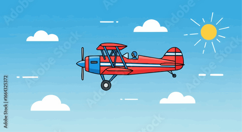 A vibrant red and blue biplane soars through a clear blue sky on a sunny day, with fluffy white clouds dotting the horizon.