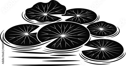 Elegant water lily pads floating peacefully on a pond in black and white