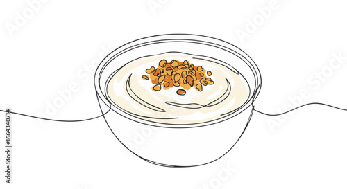 A delicious yogurt parfait is served in a clear bowl with toppings.