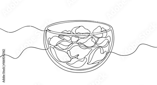 Minimalist art of chips in a glass bowl. 