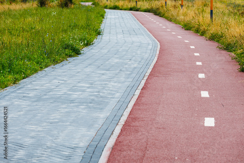 Walking and cycling paths run along the edge of the city park