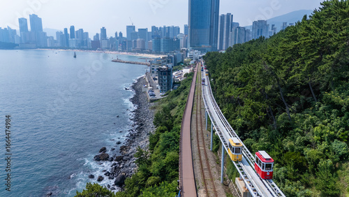 Wallpaper Mural Busan, South Korea Colorful Sky Capsule train, a landmark seaside railway route, a destination where tourists take a train by the sea. Sky Capsule Haeundae August 2, 2025 Torontodigital.ca