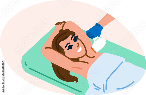 Beautician removing hair with laser treatment from female client armpit