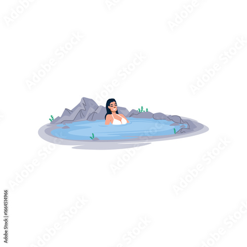 Woman relaxing in geothermal hot spring surrounded by rocks