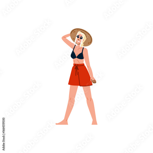 Smiling blonde woman wearing summer outfit walking barefoot on beach