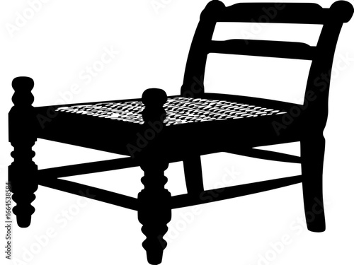A simple, black-and-white silhouette of a traditional wooden chair with a woven seat. The chair has thick, rounded legs and a straight backrest, shown in three-quarter view from a slightly elevated pe