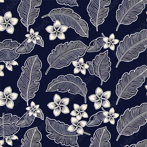 Seamless Pattern, Tropical pattern featuring exotic leaves and flowers on a navy background Stock royalty free