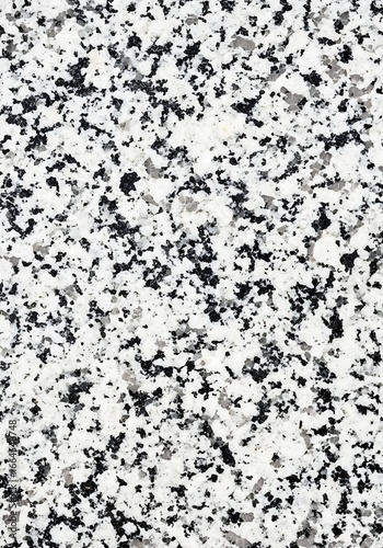 Intricate granular patterns showcasing natural stone textures with contrasting light and dark elements creating a