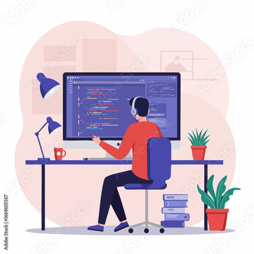 Male software developer sitting at a desk and writing code on a large computer screen, illustrating the concept of programming and remote work