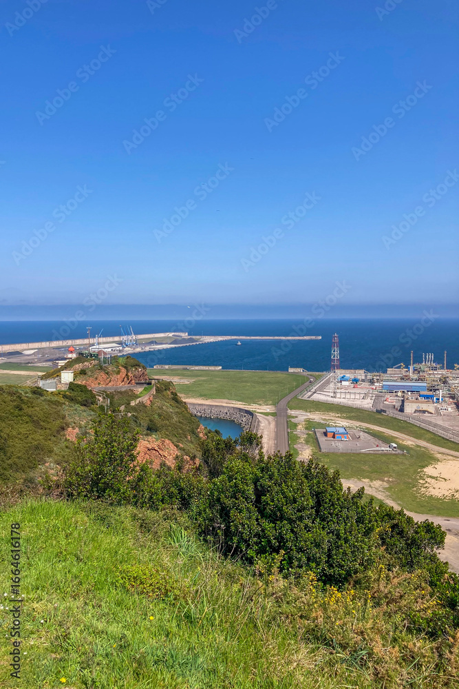 Obraz premium Gijón port settlements amidst scenic coastal landscapes in Gijón, Asturias, Spain
