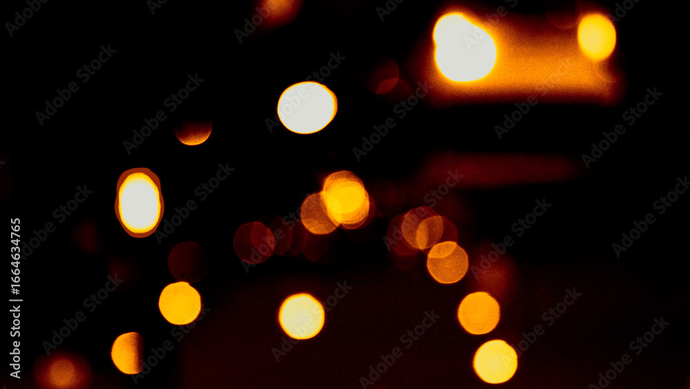 Obraz premium Defocused bokeh lights. Blurred abstract glitter texture. Background shining golden light