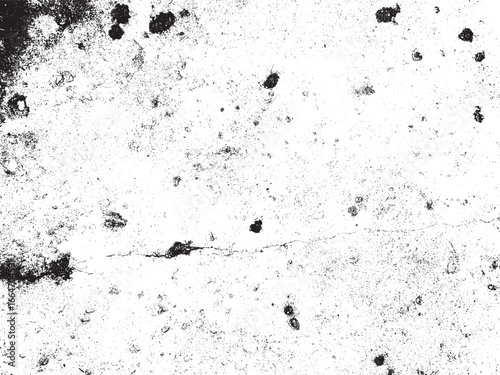 A high-contrast image showcasing a white, rough texture with prominent dark grunge elements. The surface is marked by stains, cracks, and speckled patterns, creating a weathered effect.