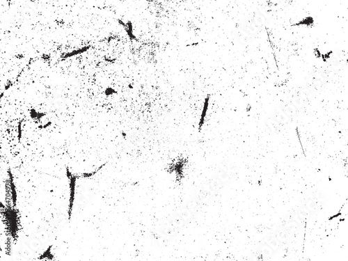 A white surface exhibits a distressed pattern, marked by dark specks and scratches. This creates a high-contrast, grainy texture suitable for various design applications.