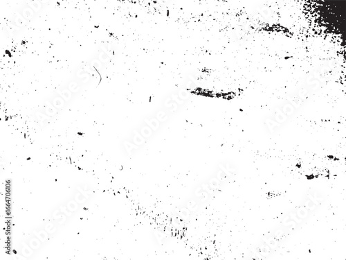 A textured white surface is shown with a splattered black pattern, creating a sense of wear and a gritty effect that could be used for backgrounds or overlays.