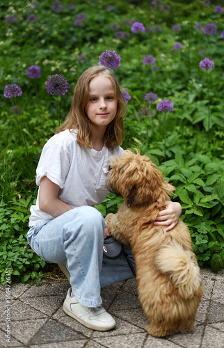 Little Girl in City Park Walking Playing with her Havanese  Bichon-type Dog Seasonal Summer Time