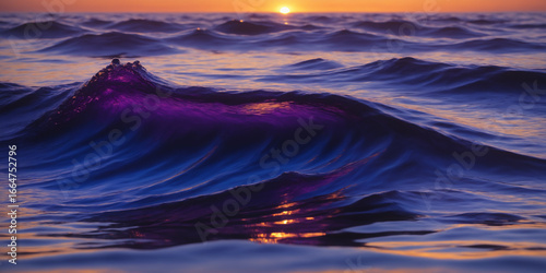 Serene Sunset Glow Reflecting on Ocean With Vibrant Purple Waves