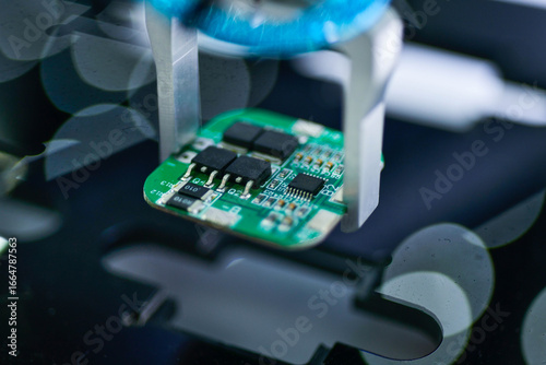 Tableau sur toile Modern Robot Arm automation system moving circuit boards in a factory ,industria