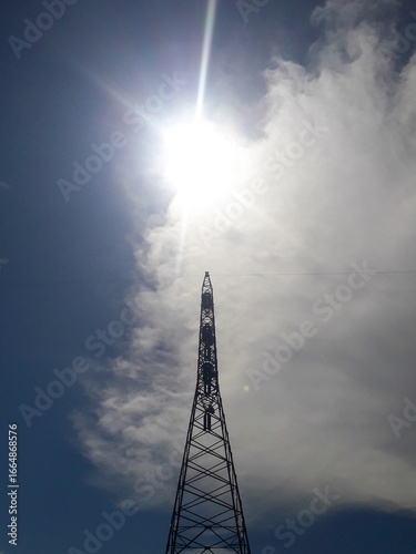 Electric transmission towers are part of the electric power system used to distribute electricity from power plants to substations and then to consumers.