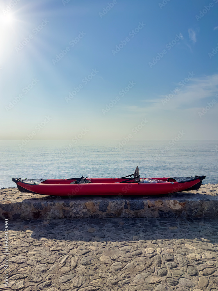Fototapeta premium Kayak on vertical shore with space for text