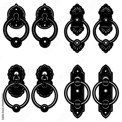 Collection of six ornate black door knockers with different designs and mounting plates displayed together