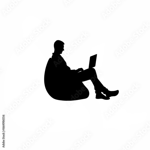 Programmer sitting on bean bag, laptop on knees silhouette on white background