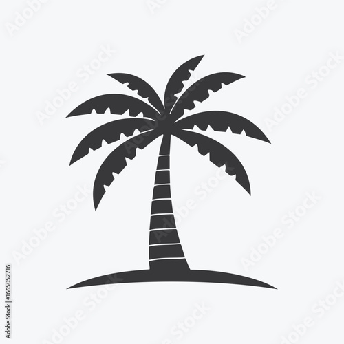 Dark silhouette of a palm tree on a small island tropical