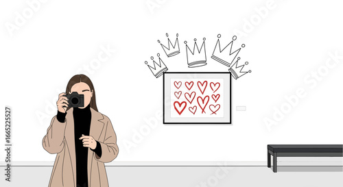 A fashionable woman takes a photo of heart art with crowns, creating a trendy vibe