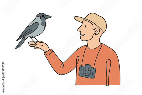 Man holding a bird on his hand while exploring nature in the morning light with a camera around his neck