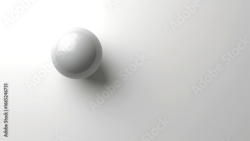 An abstract image featuring a single sphere in shades of gray on a light gray background