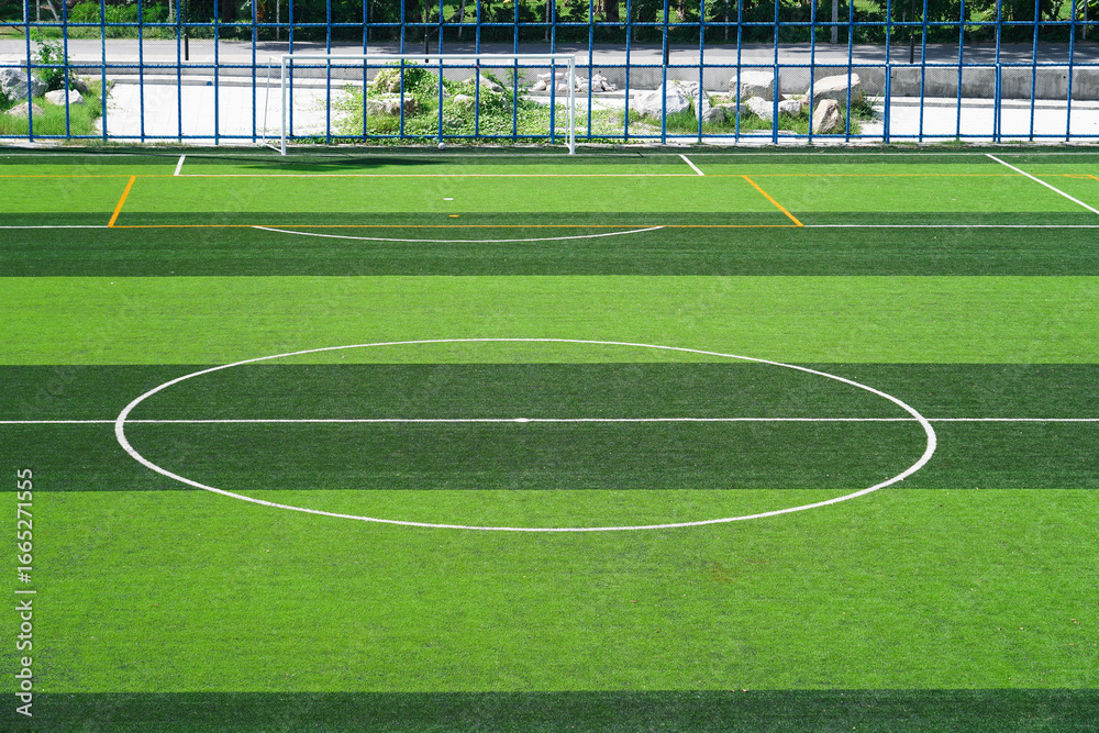 Fototapeta premium Artificial grass at football field with&nbsp;lines marking on the playing area.