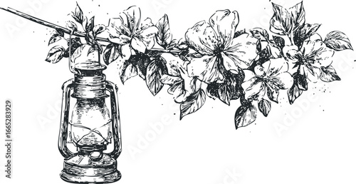 Vintage oil lantern hanging among blooming flowers and leaves