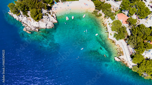 Fototapeta Naklejka Na Ścianę i Meble -  Drone Photo of Medvidina Cave and Adriatic Cove near Brela, Croatia