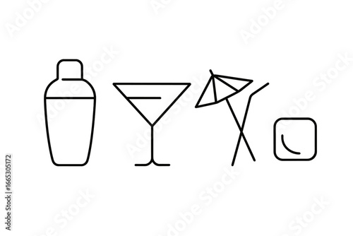 Making cocktails by the beach with shaker, glass, umbrella, and lime during a sunny afternoon