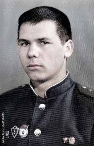 Vintage portrait of a young corporal of the Soviet army. Retro photo 1968