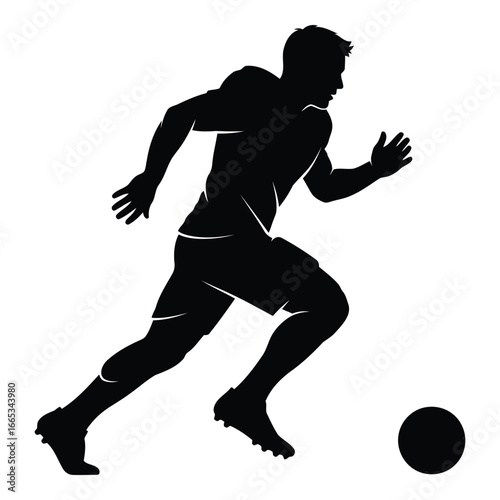 Silhouette of a soccer player in action kicking a ball on a silhouette