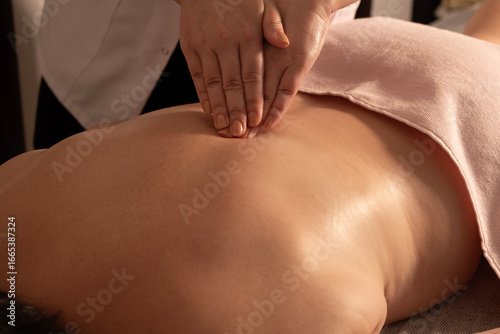 Relaxing massage therapy session. Therapeutic massage for relaxation. Professional spa body massage. Wellness and spa massage treatment.